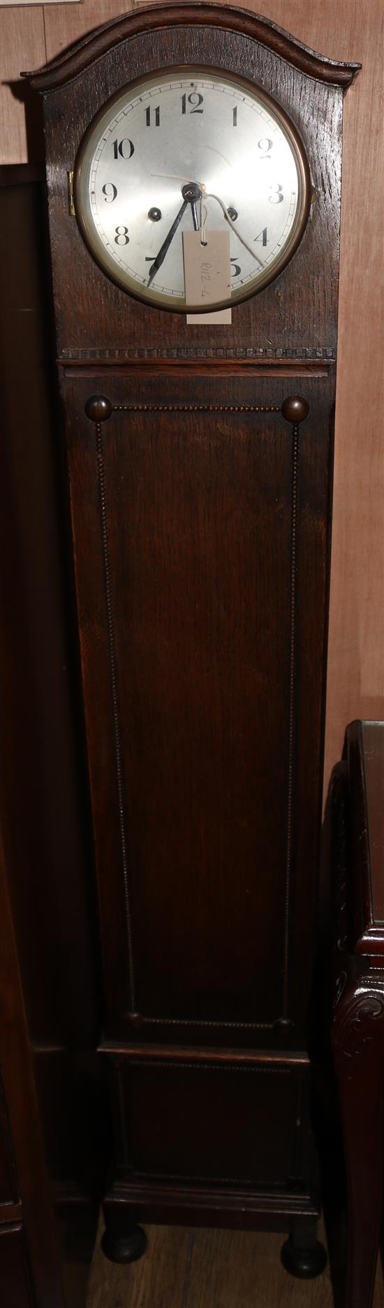 A 1930s oak grandmother clock